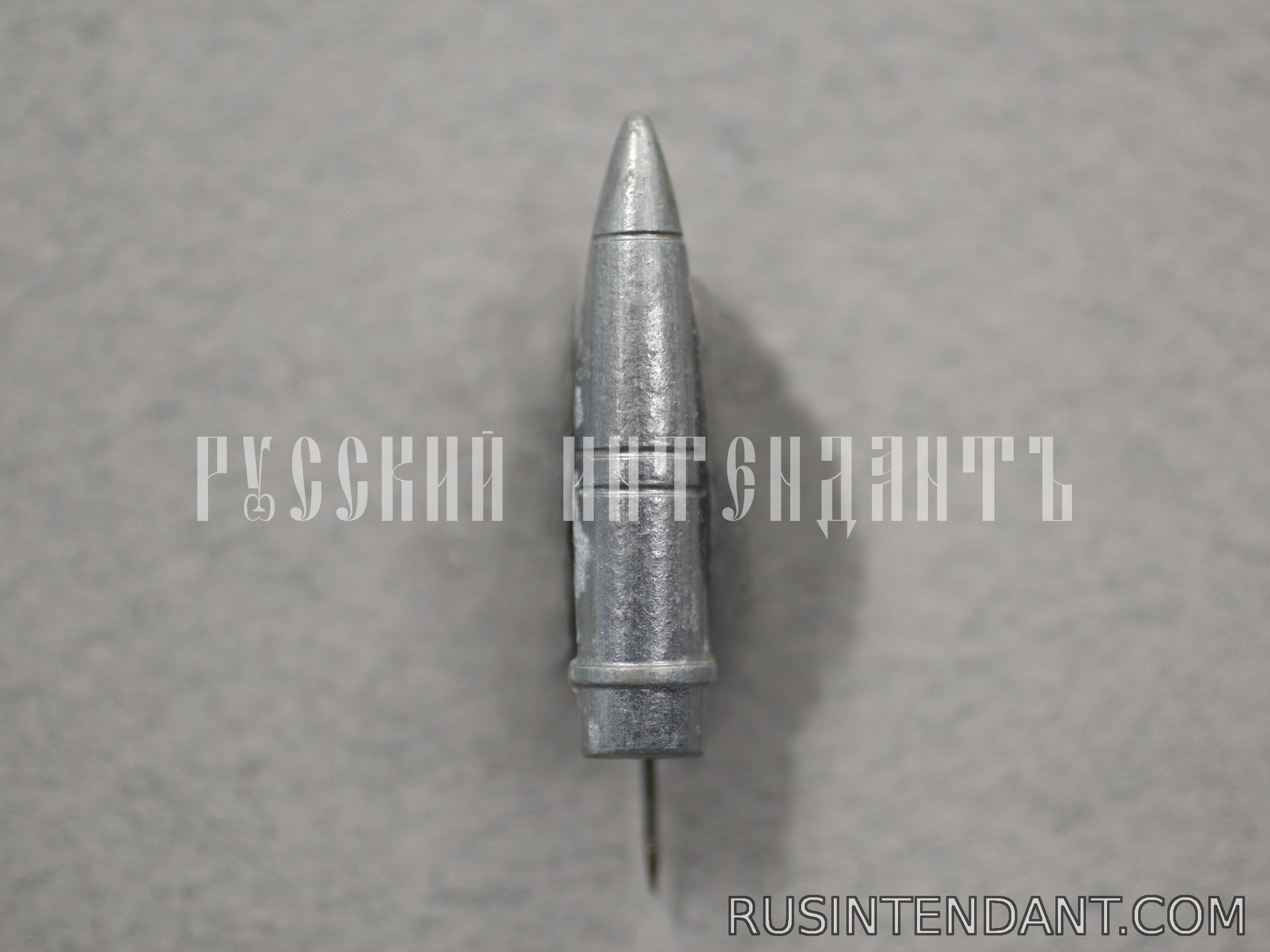 Фото 1: Знак «Артиллерийский снаряд» 